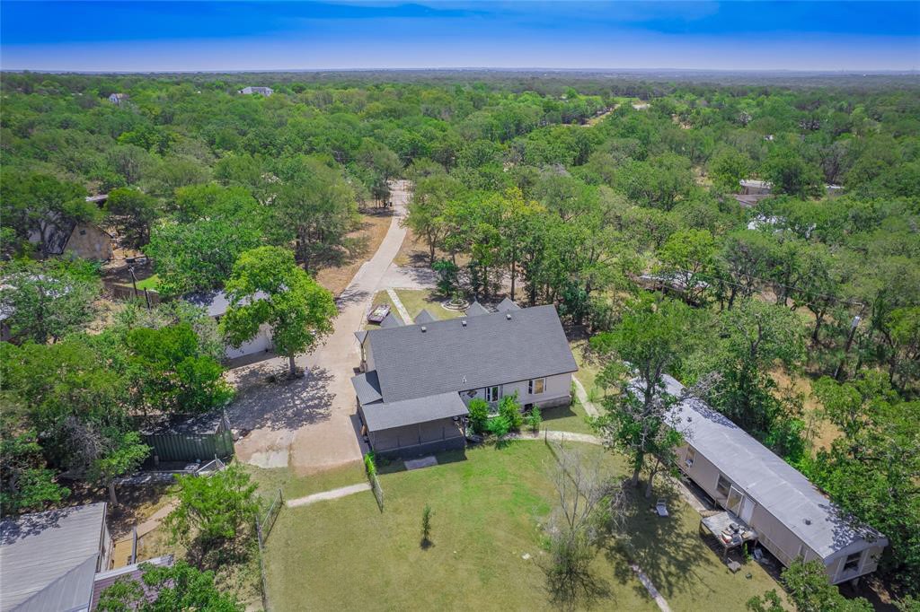 368 Riddle Road Cedar Creek, TX 78612 - Photo 4 of 16 a view of a house with a yard and sitting area