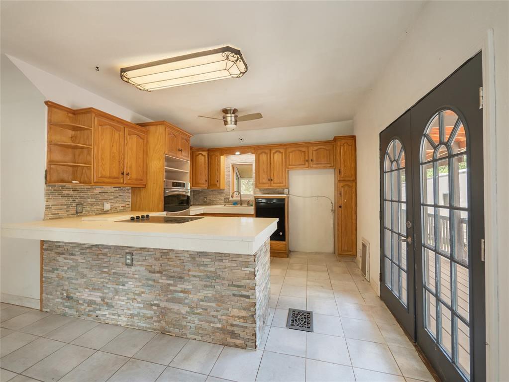 368 Riddle Road Cedar Creek, TX 78612 - Photo 7 of 16 a view of kitchen with windows