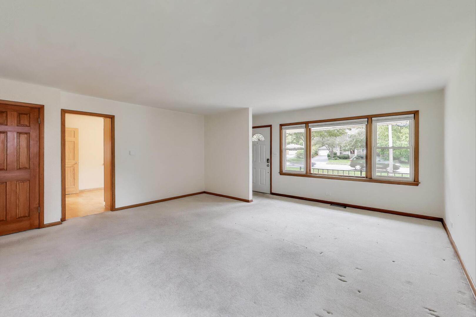 821 Warrenville Road Wheaton, IL 60189 - Photo 5 of 35 an empty room with windows