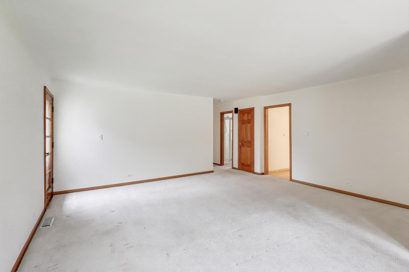 821 Warrenville Road Wheaton, IL 60189 - Photo 8 of 35 an empty room with windows
