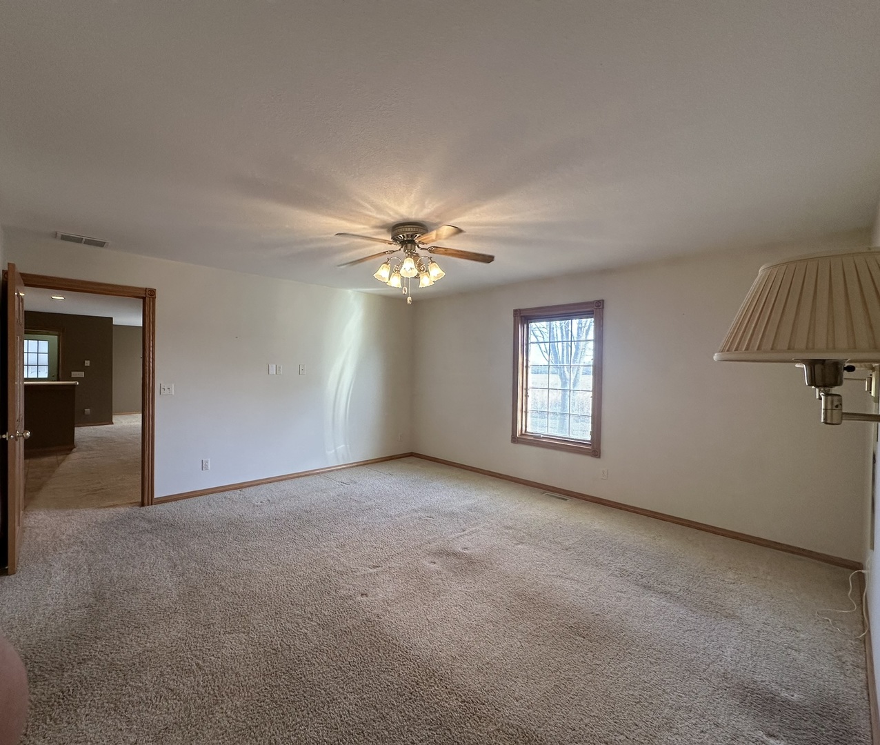 1005 North Fox Run Villa Grove, IL 61956 - Photo 30 of 45 a view of a room with a ceiling fan and a window
