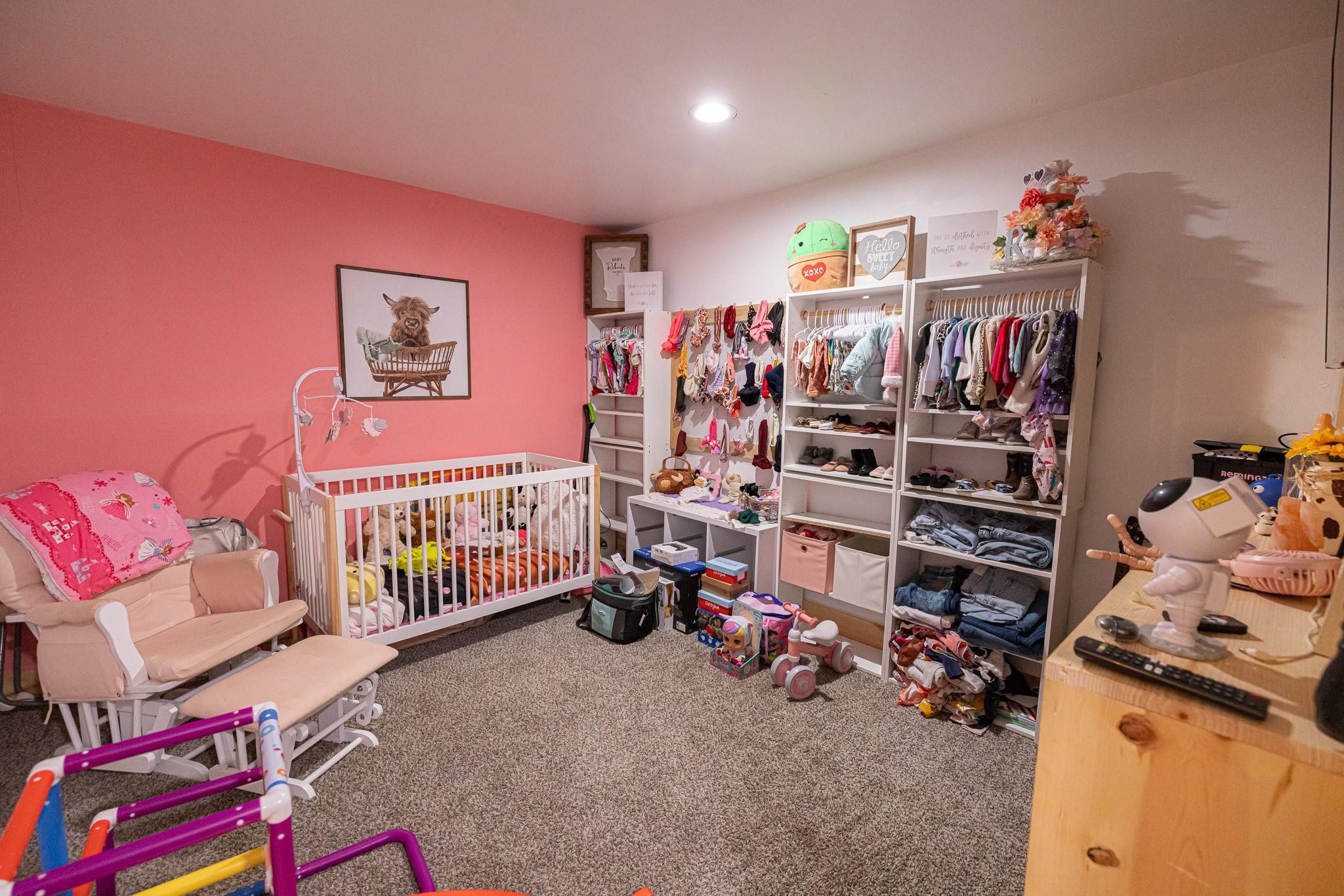 761 North Forest Cove Loop Coldspring, TX 77331 - Photo 16 of 33 a view of a bedroom with baby toys
