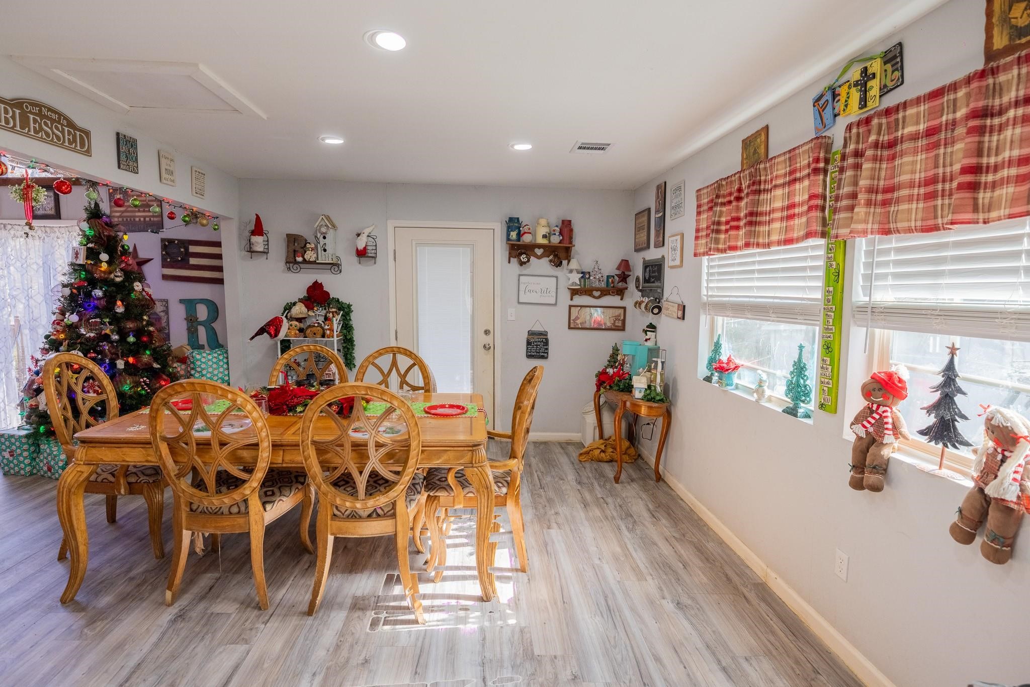 761 North Forest Cove Loop Coldspring, TX 77331 - Photo 6 of 33 a view of a dining room with furniture and wooden floor