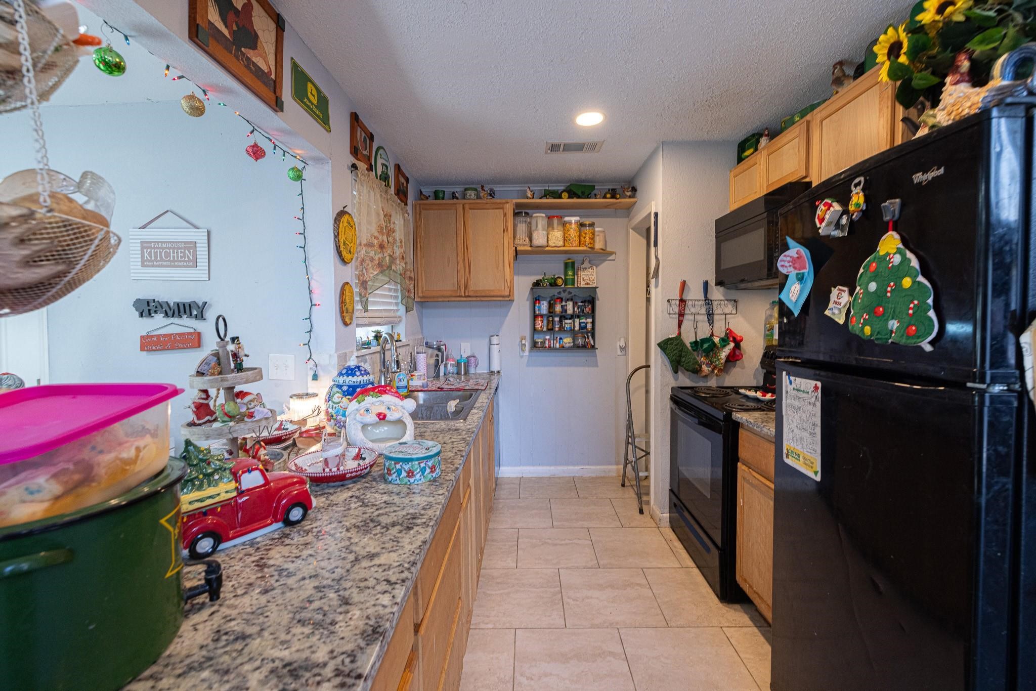 761 North Forest Cove Loop Coldspring, TX 77331 - Photo 8 of 33 a living room with furniture and a flat screen tv