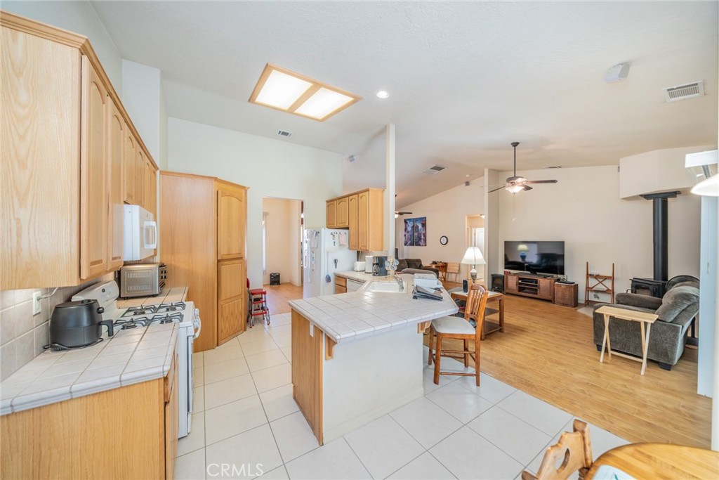 13880 Paramount Road Phelan, CA 92371 - Photo 12 of 54 a living room with furniture and a large window