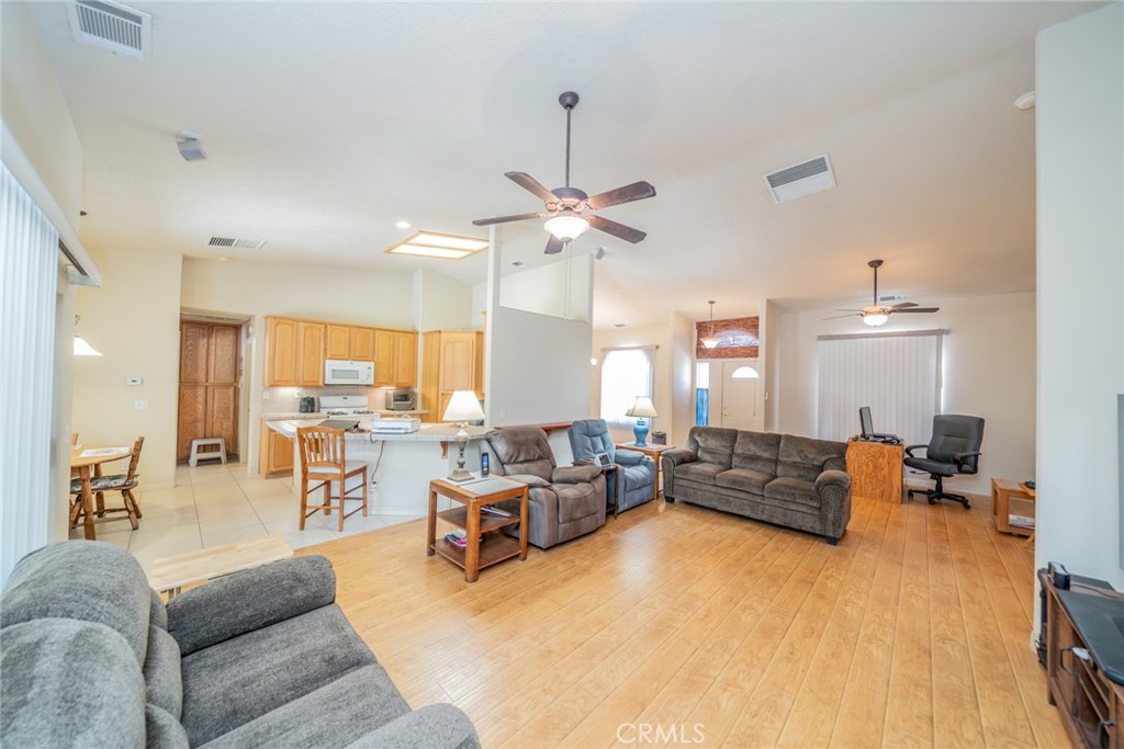 13880 Paramount Road Phelan, CA 92371 - Photo 15 of 54 a living room with furniture and a large window