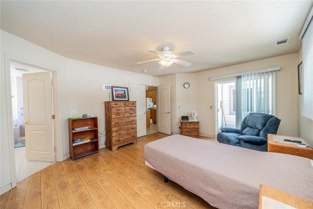 13880 Paramount Road Phelan, CA 92371 - Photo 19 of 54 a bedroom with a bed and furniture