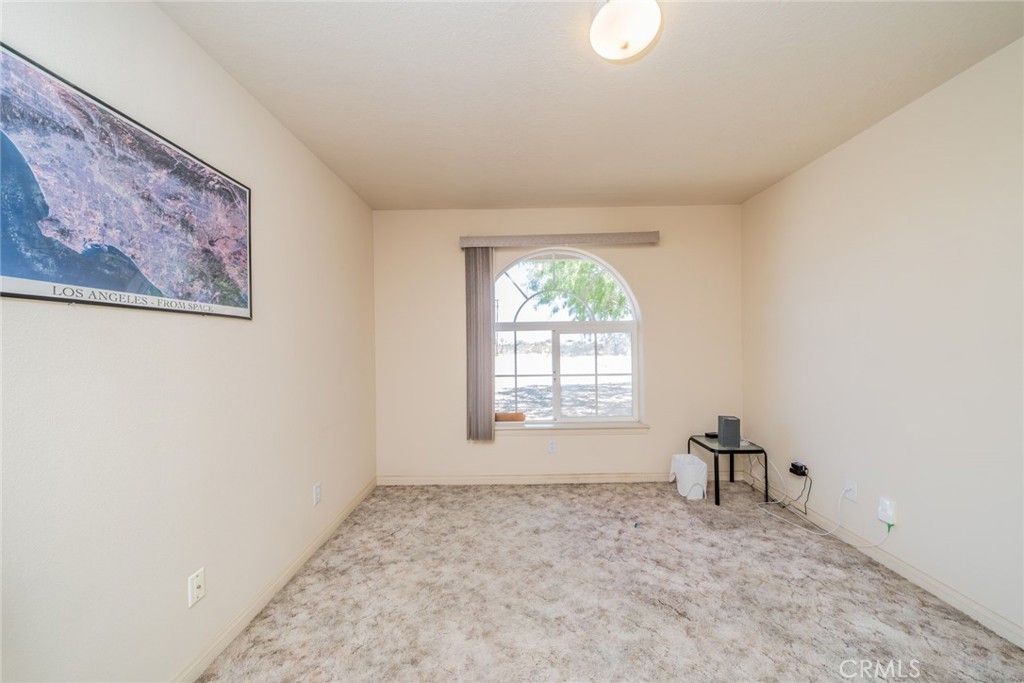 13880 Paramount Road Phelan, CA 92371 - Photo 31 of 54 an empty room with windows