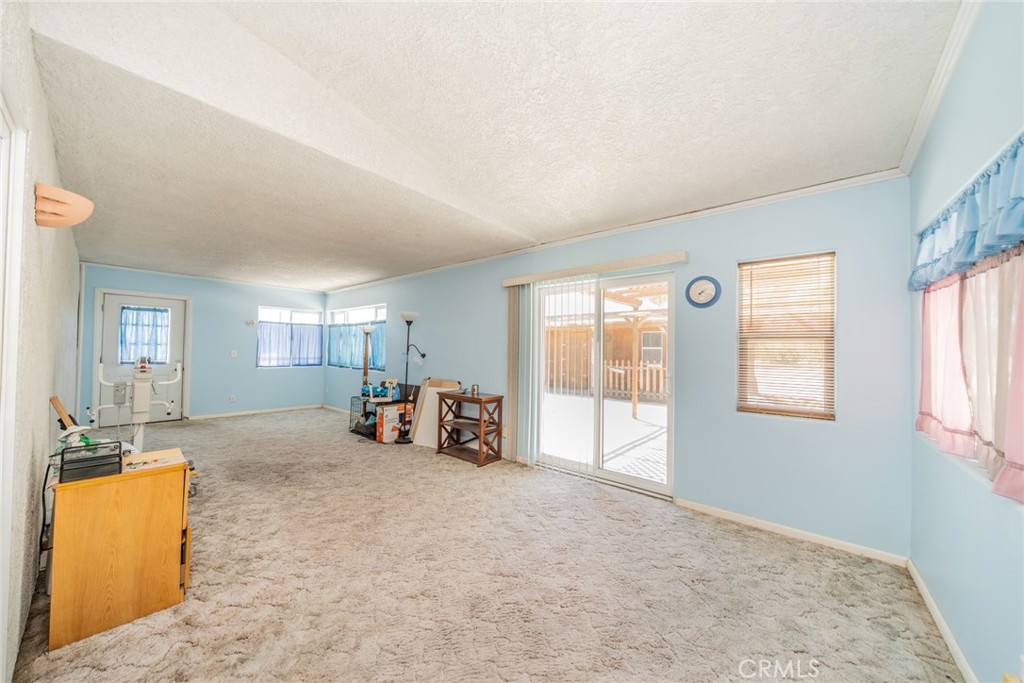 13880 Paramount Road Phelan, CA 92371 - Photo 33 of 54 a view of a livingroom with furniture and a window