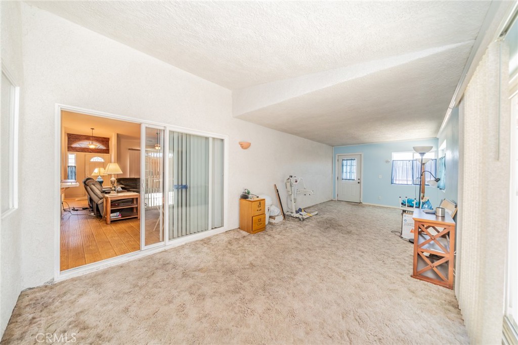 13880 Paramount Road Phelan, CA 92371 - Photo 34 of 54 a bedroom with furniture and a gym equipment