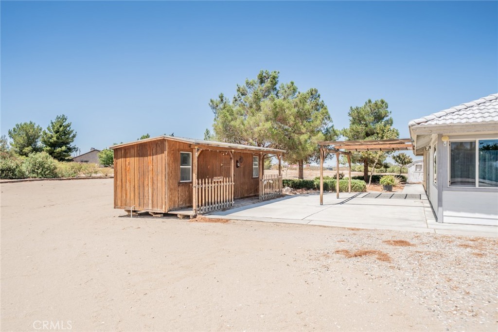 13880 Paramount Road Phelan, CA 92371 - Photo 44 of 54 a view of a backyard of the house