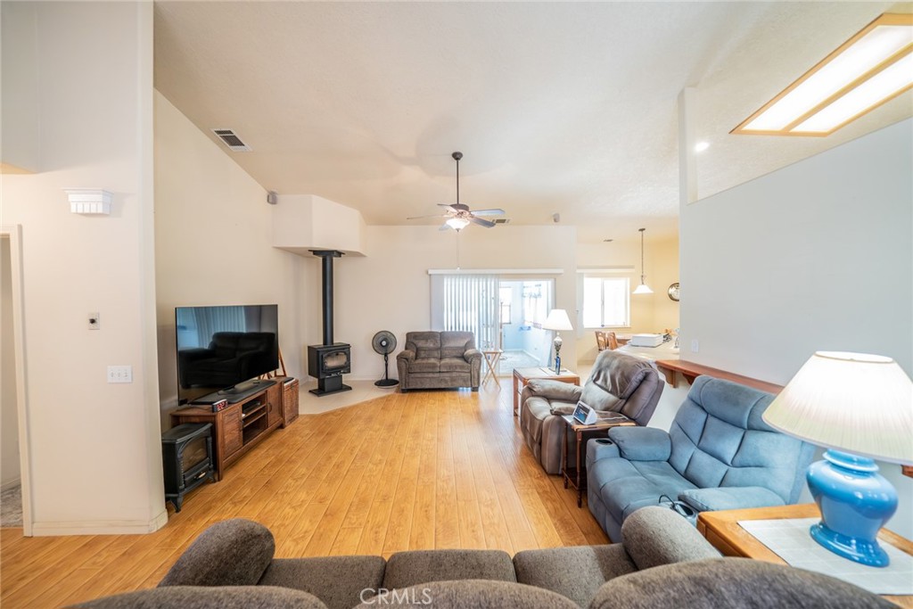 13880 Paramount Road Phelan, CA 92371 - Photo 6 of 54 a living room with furniture and a flat screen tv