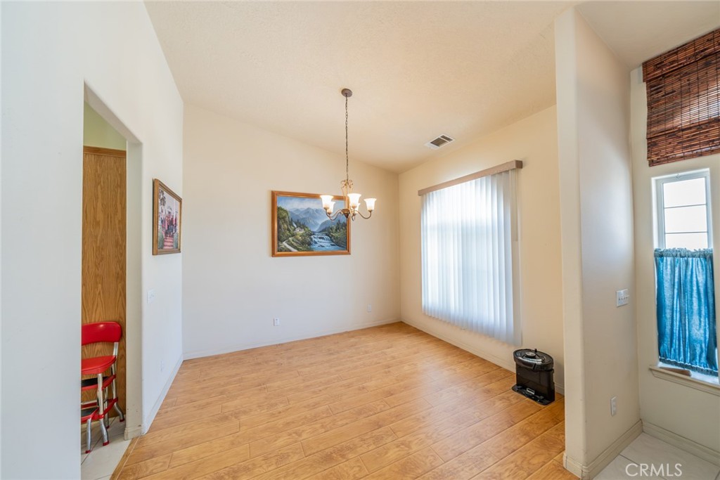 13880 Paramount Road Phelan, CA 92371 - Photo 9 of 54 a view of an empty room with window and closet