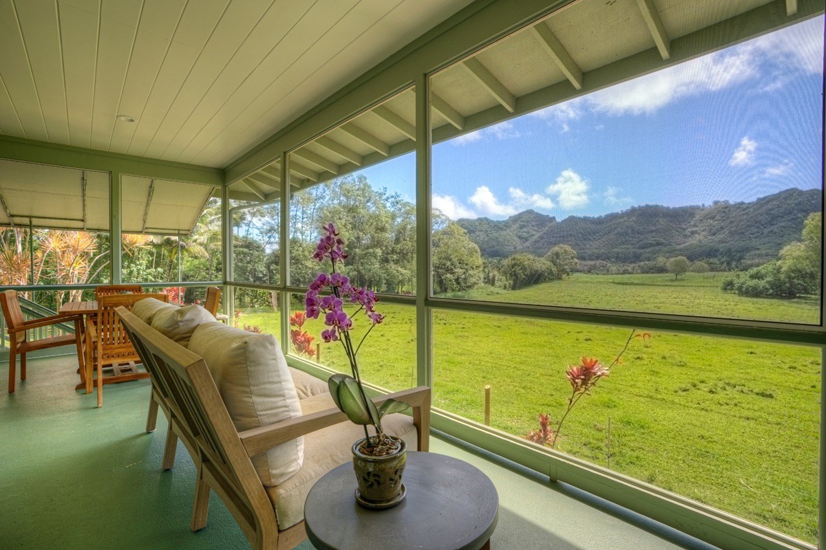 444 A Puuopae Road, Unit 2 Kapaa, HI 96746 - Photo 1 of 14 a view of a chairs and table in patio with a lake view