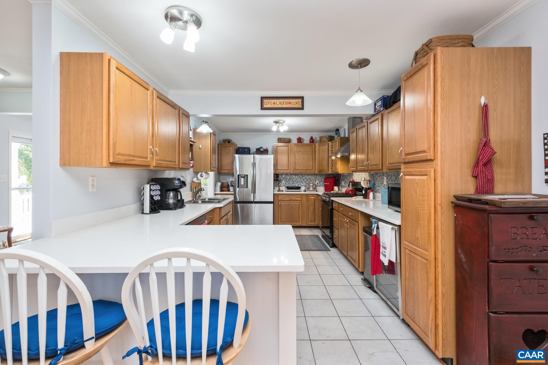 162 Rolling Hills Road Ruckersville, VA 22968 - Photo 12 of 48 a kitchen with stainless steel appliances granite countertop a refrigerator a stove and a cabinets