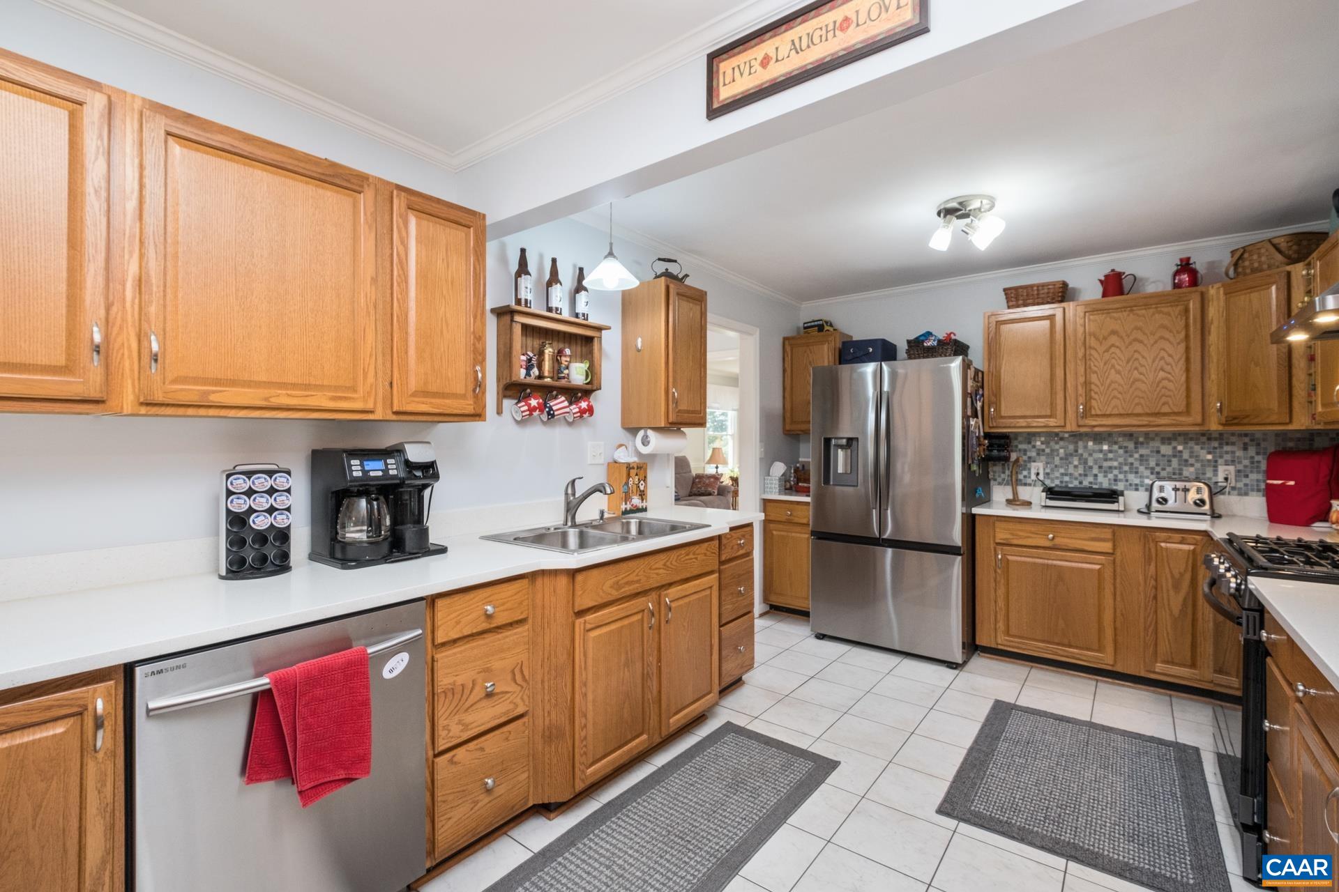 162 Rolling Hills Road Ruckersville, VA 22968 - Photo 13 of 48 a kitchen with stainless steel appliances granite countertop a refrigerator and sink