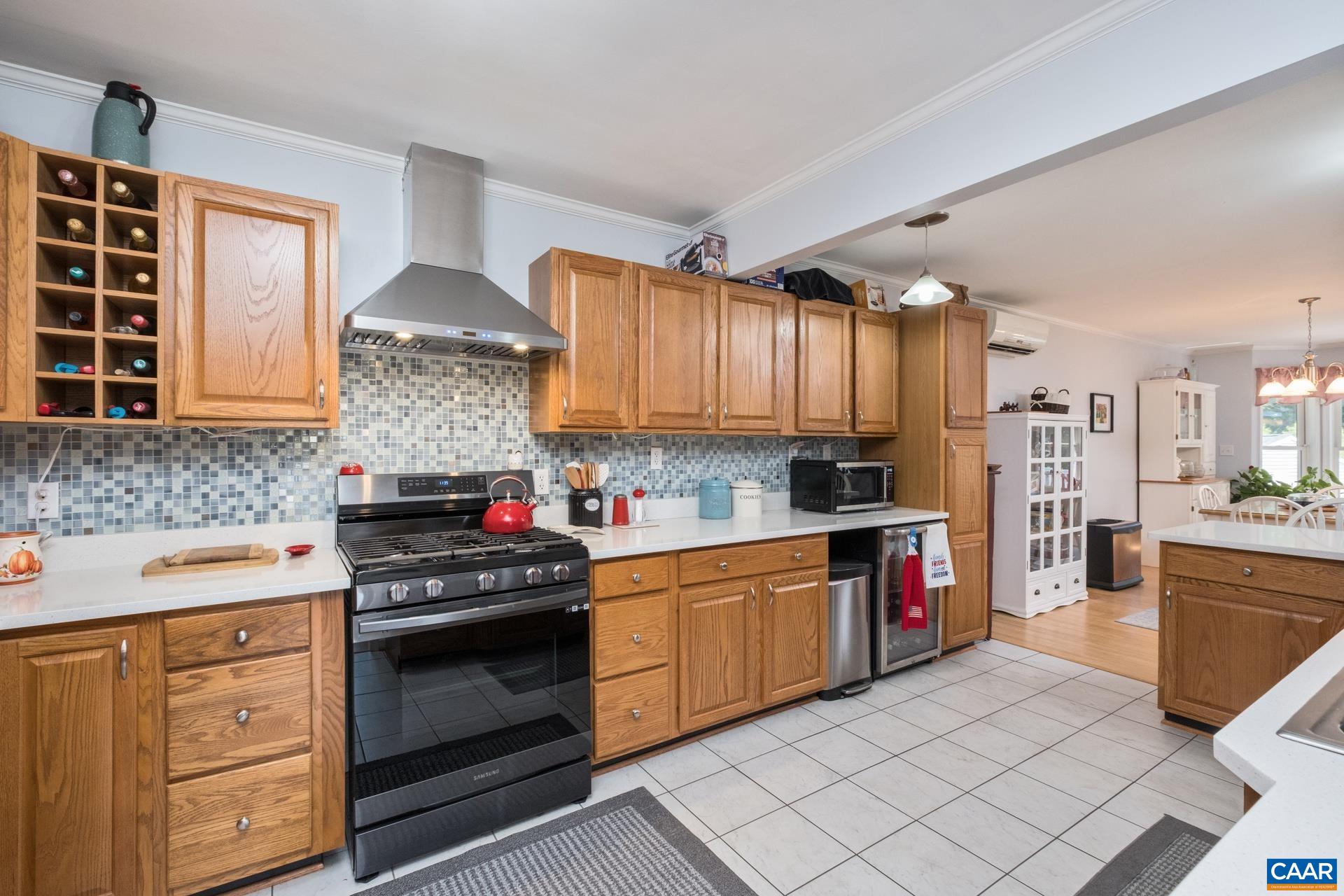 162 Rolling Hills Road Ruckersville, VA 22968 - Photo 14 of 48 a kitchen with stainless steel appliances a stove sink and cabinets