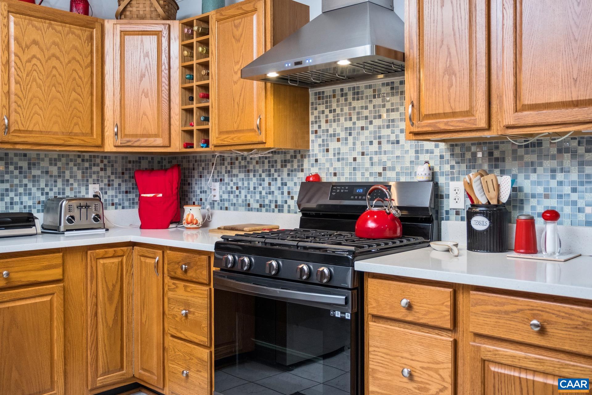 162 Rolling Hills Road Ruckersville, VA 22968 - Photo 15 of 48 a kitchen with stainless steel appliances granite countertop a sink stove and cabinets