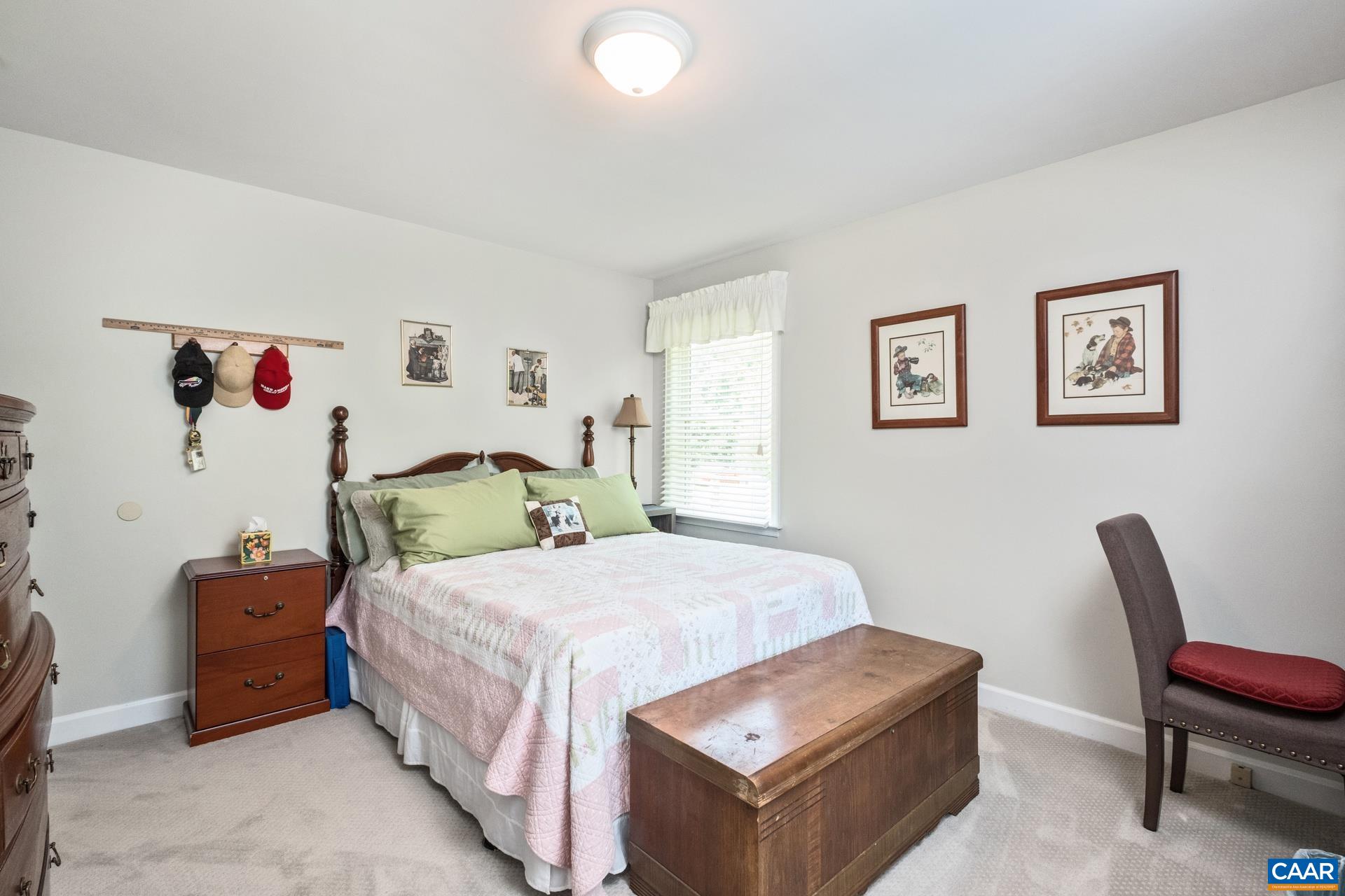 162 Rolling Hills Road Ruckersville, VA 22968 - Photo 26 of 48 a bedroom with a bed and a chair