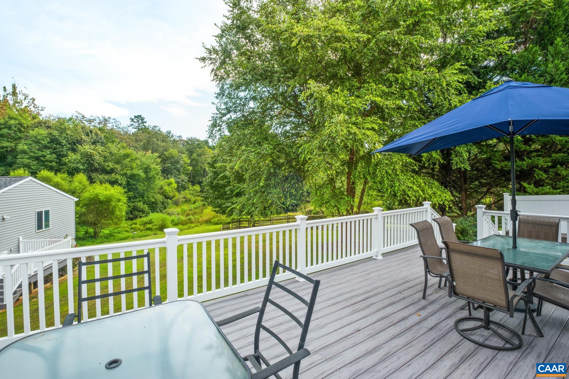 162 Rolling Hills Road Ruckersville, VA 22968 - Photo 37 of 48 a view of a chair and table on the deck