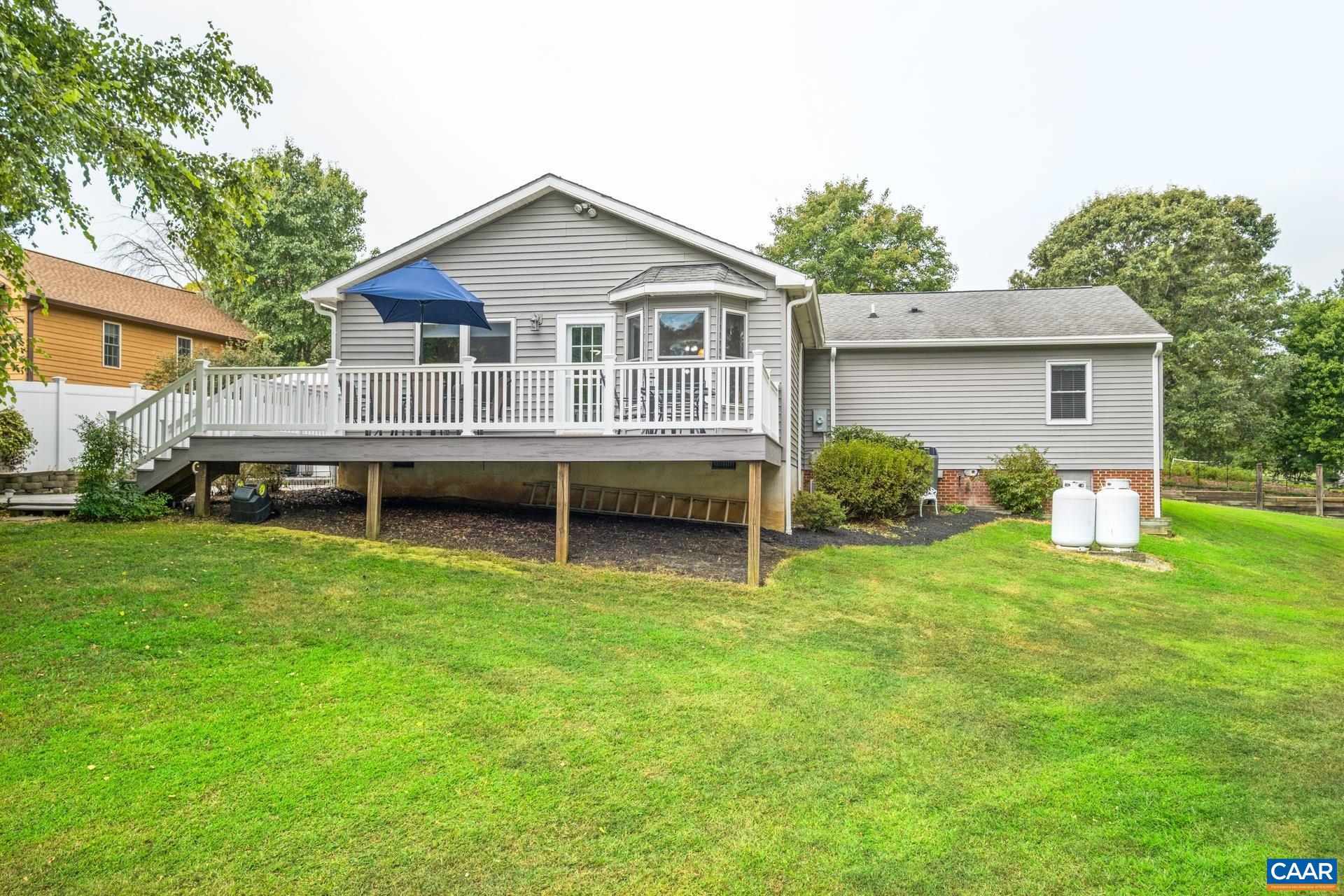162 Rolling Hills Road Ruckersville, VA 22968 - Photo 38 of 48 a view of a house with a backyard and a patio