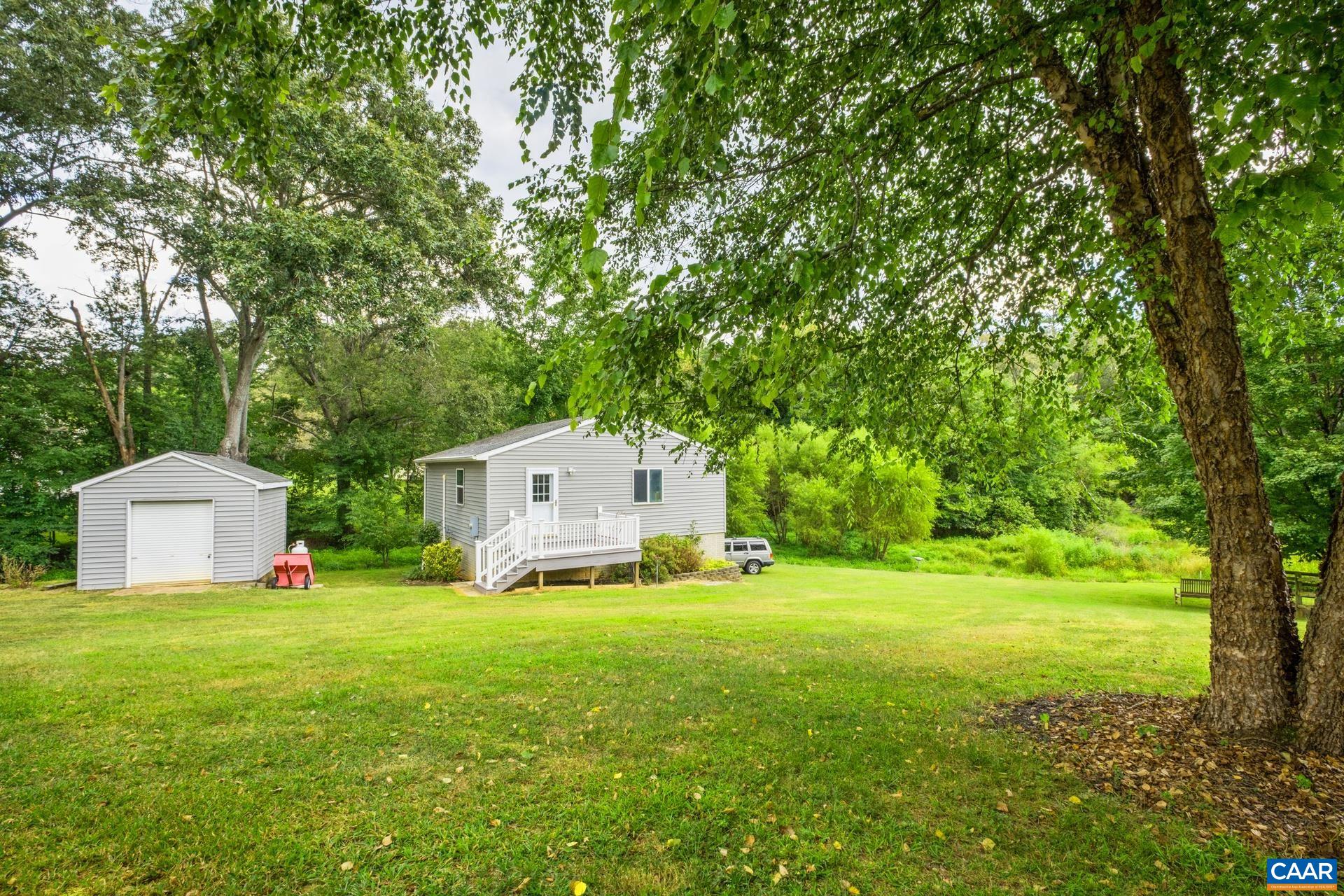 162 Rolling Hills Road Ruckersville, VA 22968 - Photo 44 of 48 a view of a house with big yard and large trees