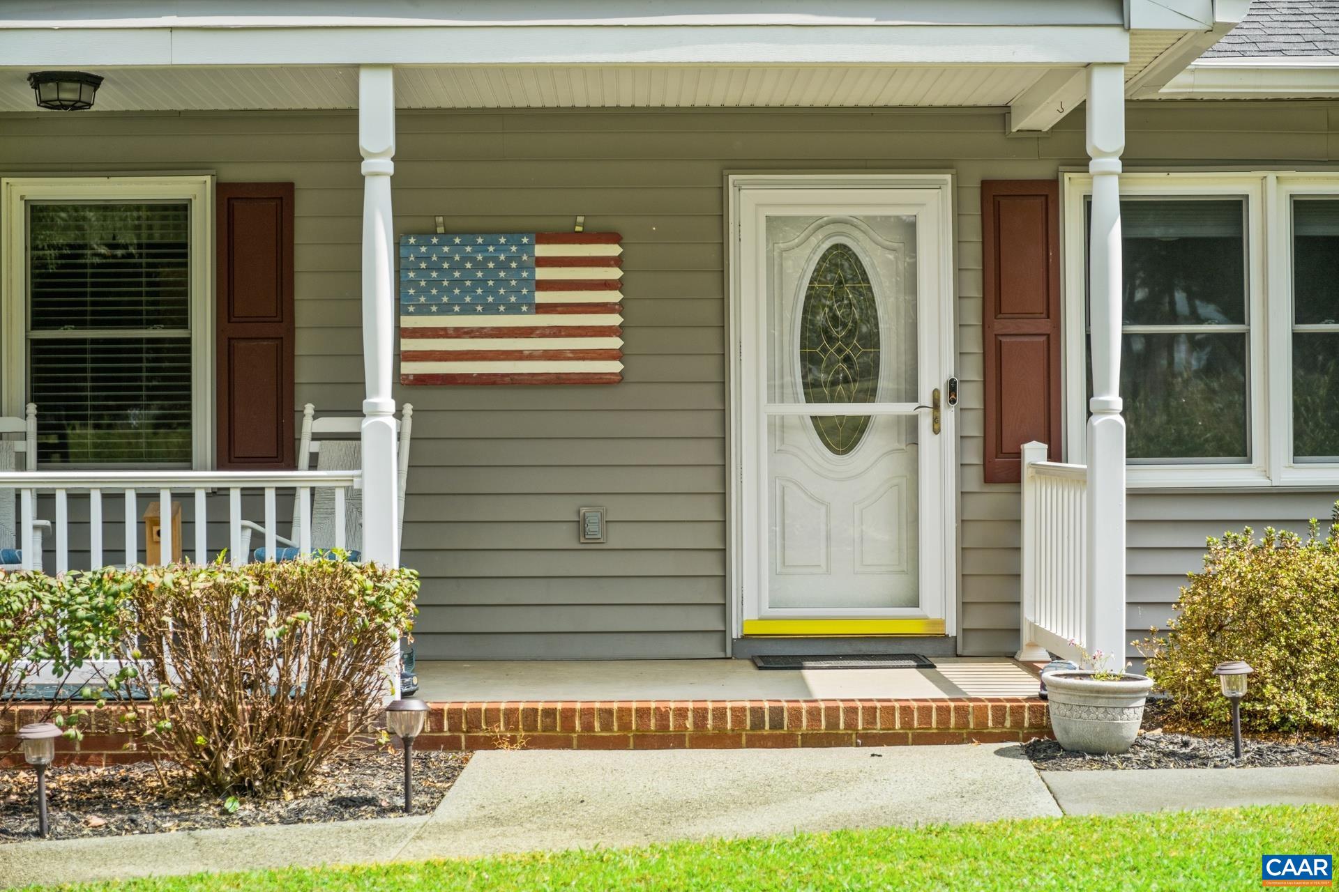 162 Rolling Hills Road Ruckersville, VA 22968 - Photo 7 of 48 a front view of a house with a garden