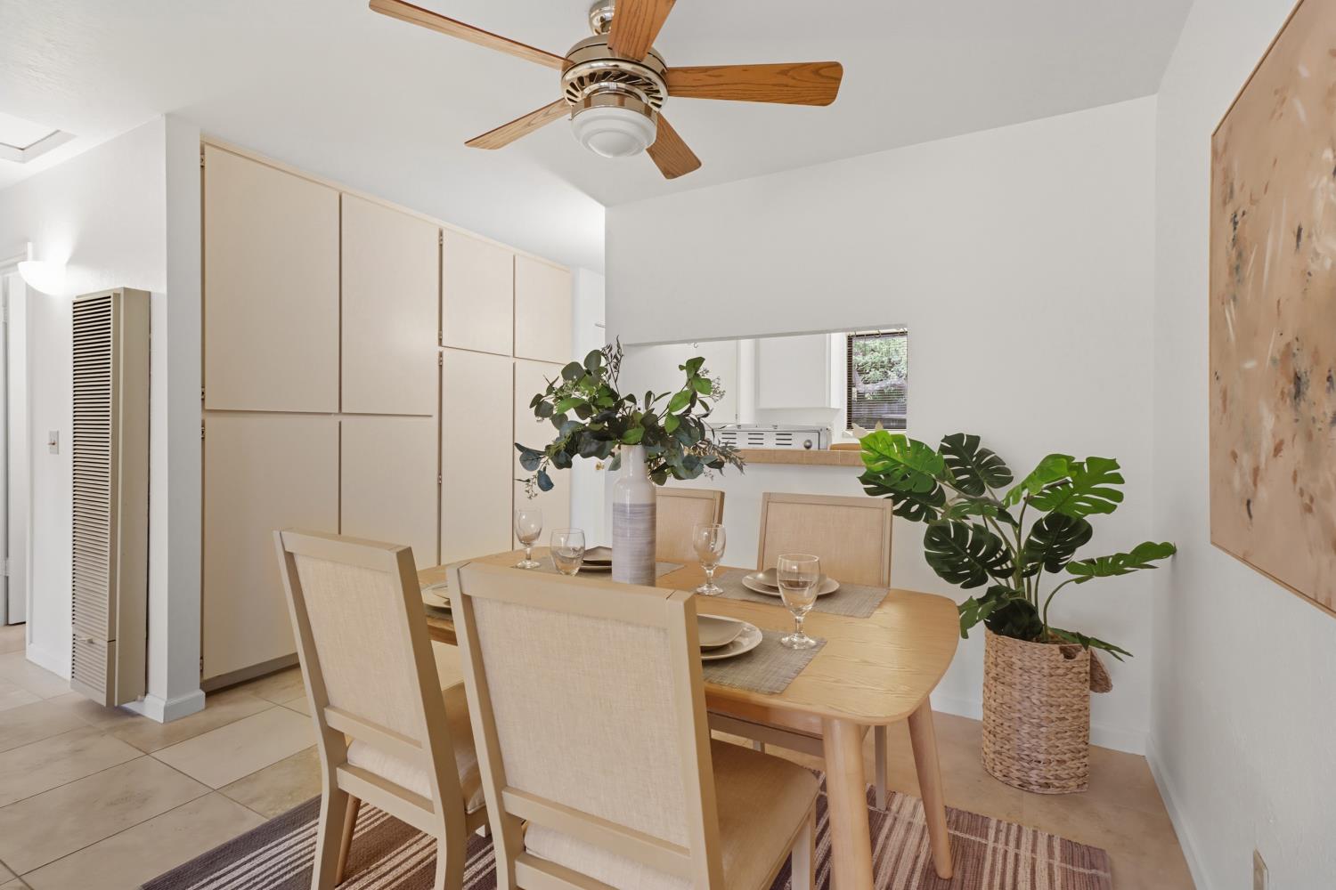 2526 Overhill Lane Davis, CA 95616 - Photo 20 of 60 a dining room with furniture potted plants and wooden floor