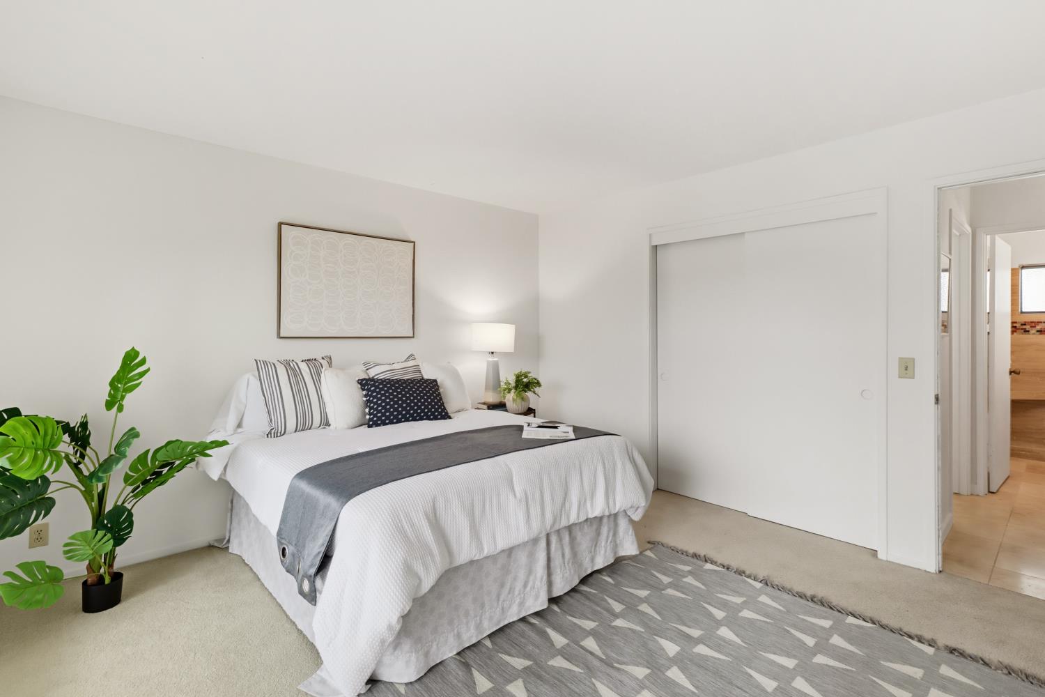 2526 Overhill Lane Davis, CA 95616 - Photo 28 of 60 a bedroom with a bed and a potted plant
