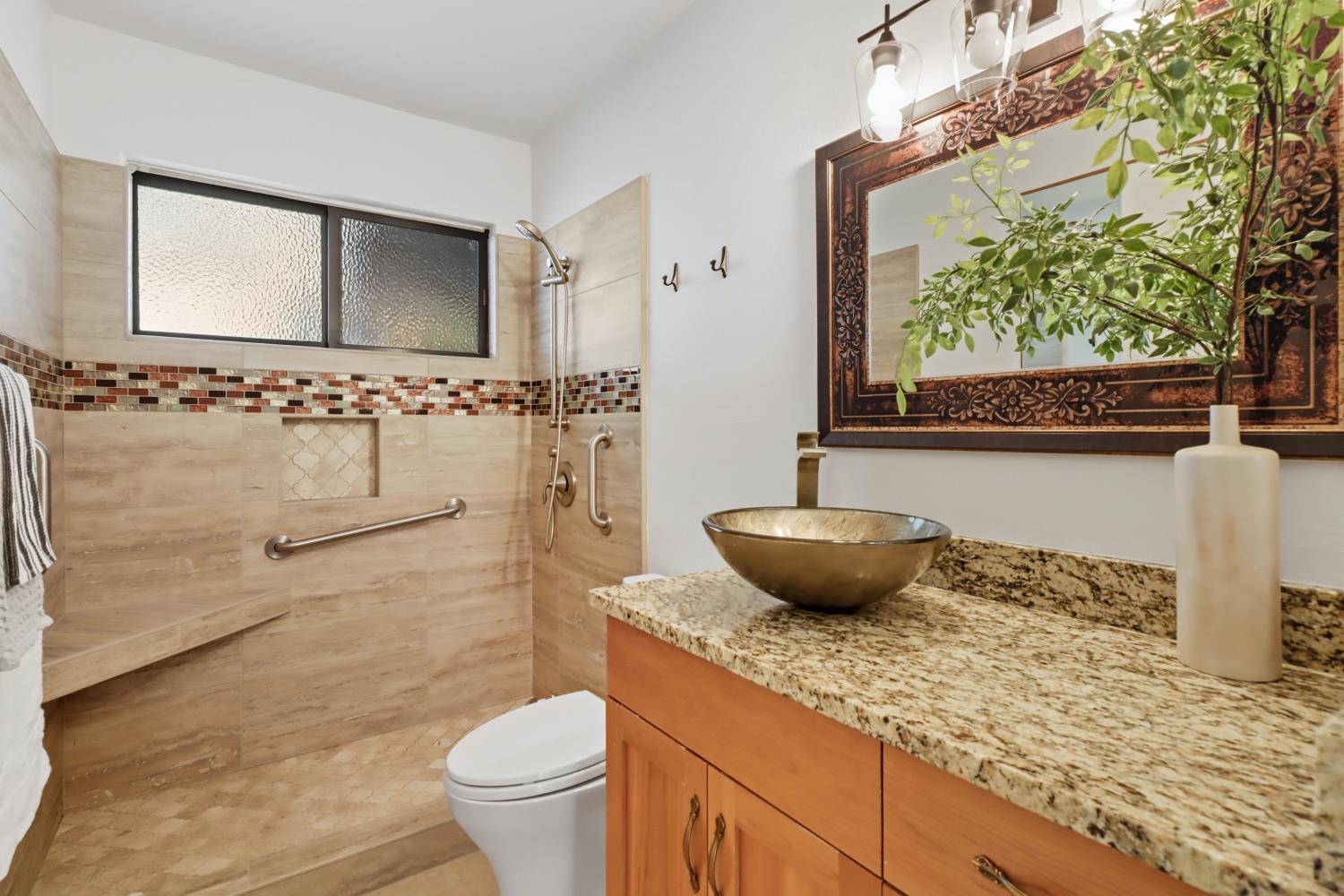 2526 Overhill Lane Davis, CA 95616 - Photo 30 of 60 a bathroom with a granite countertop sink and a mirror