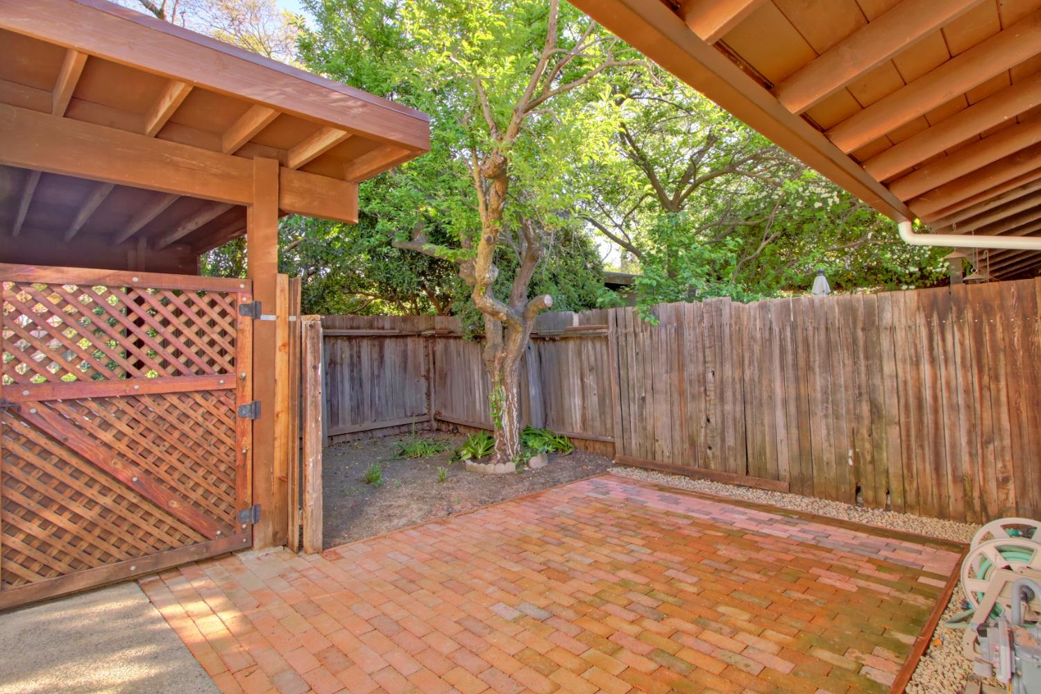 2526 Overhill Lane Davis, CA 95616 - Photo 3 of 60 a backyard of a house with a small barn and wooden fence