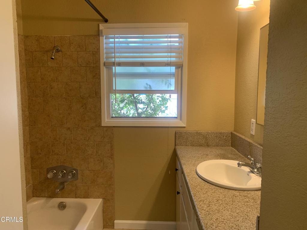 938 Ford Street Corona, CA 92879 - Photo 17 of 36 a bathroom with a sink a toilet and shower