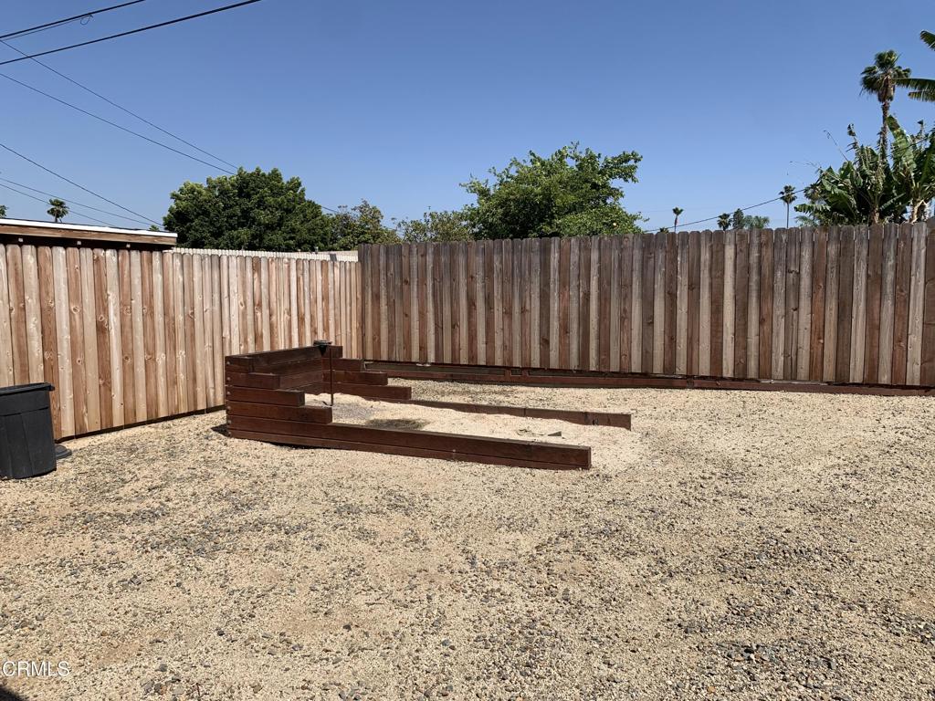 938 Ford Street Corona, CA 92879 - Photo 35 of 36 a view of a backyard with wooden fence