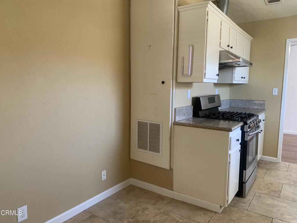 938 Ford Street Corona, CA 92879 - Photo 9 of 36 a kitchen with stainless steel appliances granite countertop a sink and a stove