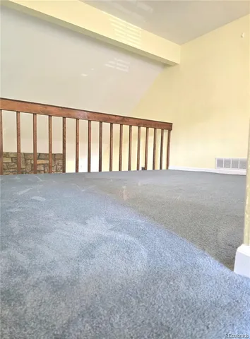 a bathroom with a granite countertop sink a toilet and mirror