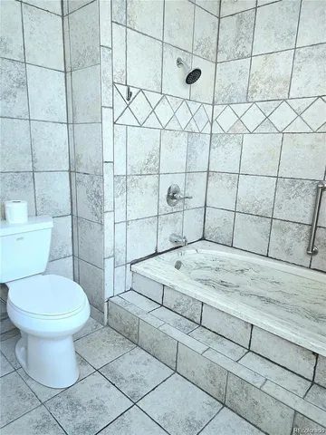 a view of a sink and utility room