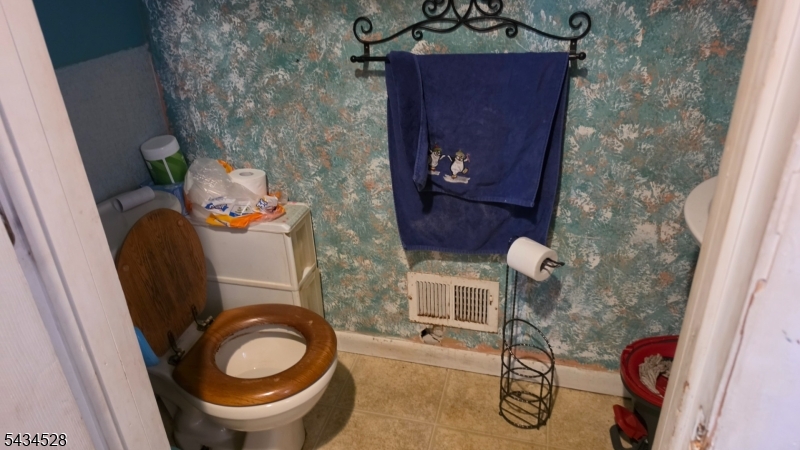 1115 West Camplain Road Manville, NJ 08835 - Photo 9 of 18 a bathroom with a toilet and a sink