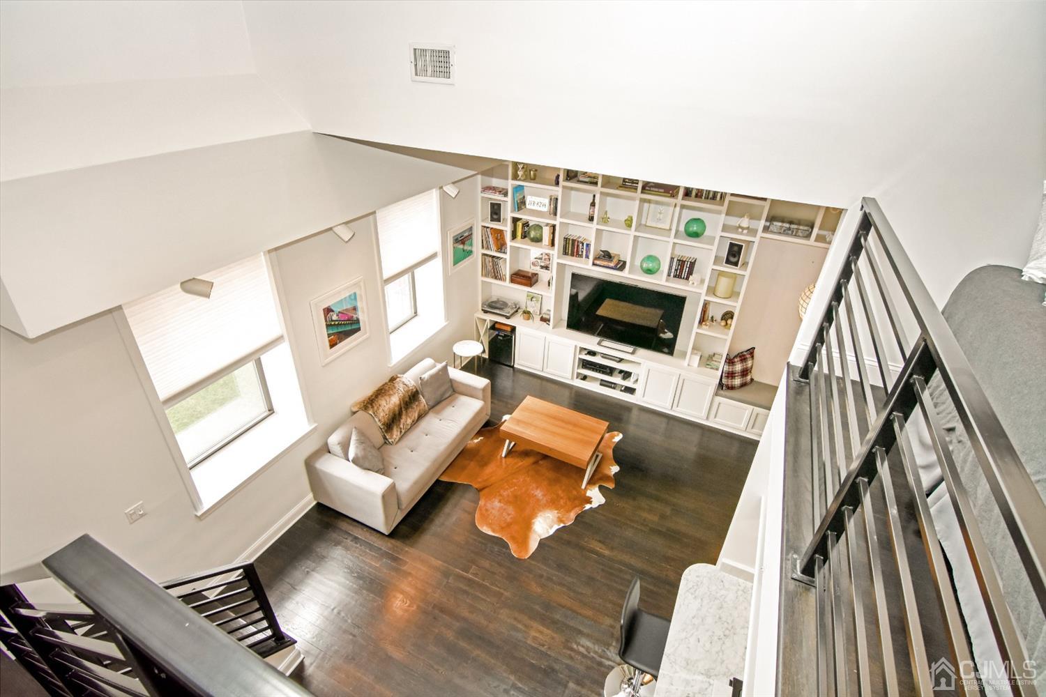 222 Clinton Street, Unit 23 Hoboken, NJ 07030 - Photo 2 of 12 a living room with furniture and a flat screen tv