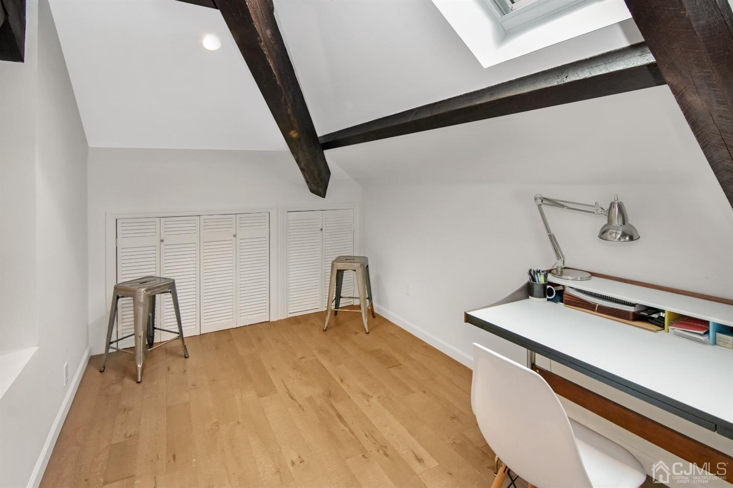 222 Clinton Street, Unit 23 Hoboken, NJ 07030 - Photo 7 of 12 a room with a wooden floor and furniture