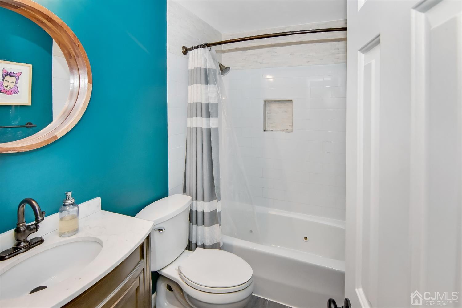 222 Clinton Street, Unit 23 Hoboken, NJ 07030 - Photo 8 of 12 a bathroom with a sink toilet and shower