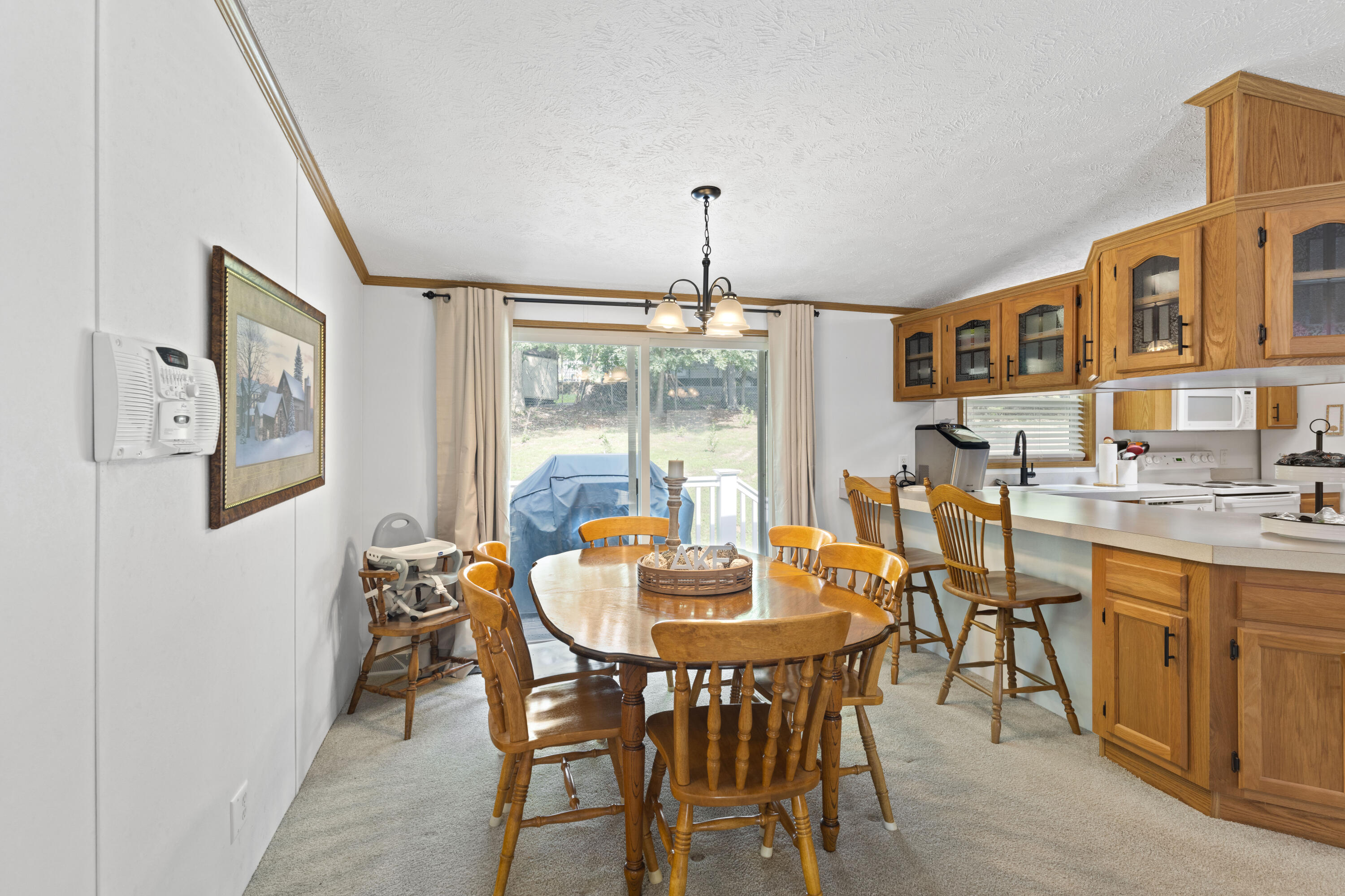 391 Cool Branch Road Penhook, VA 24137 - Photo 22 of 54 a dining room with furniture a chandelier and window