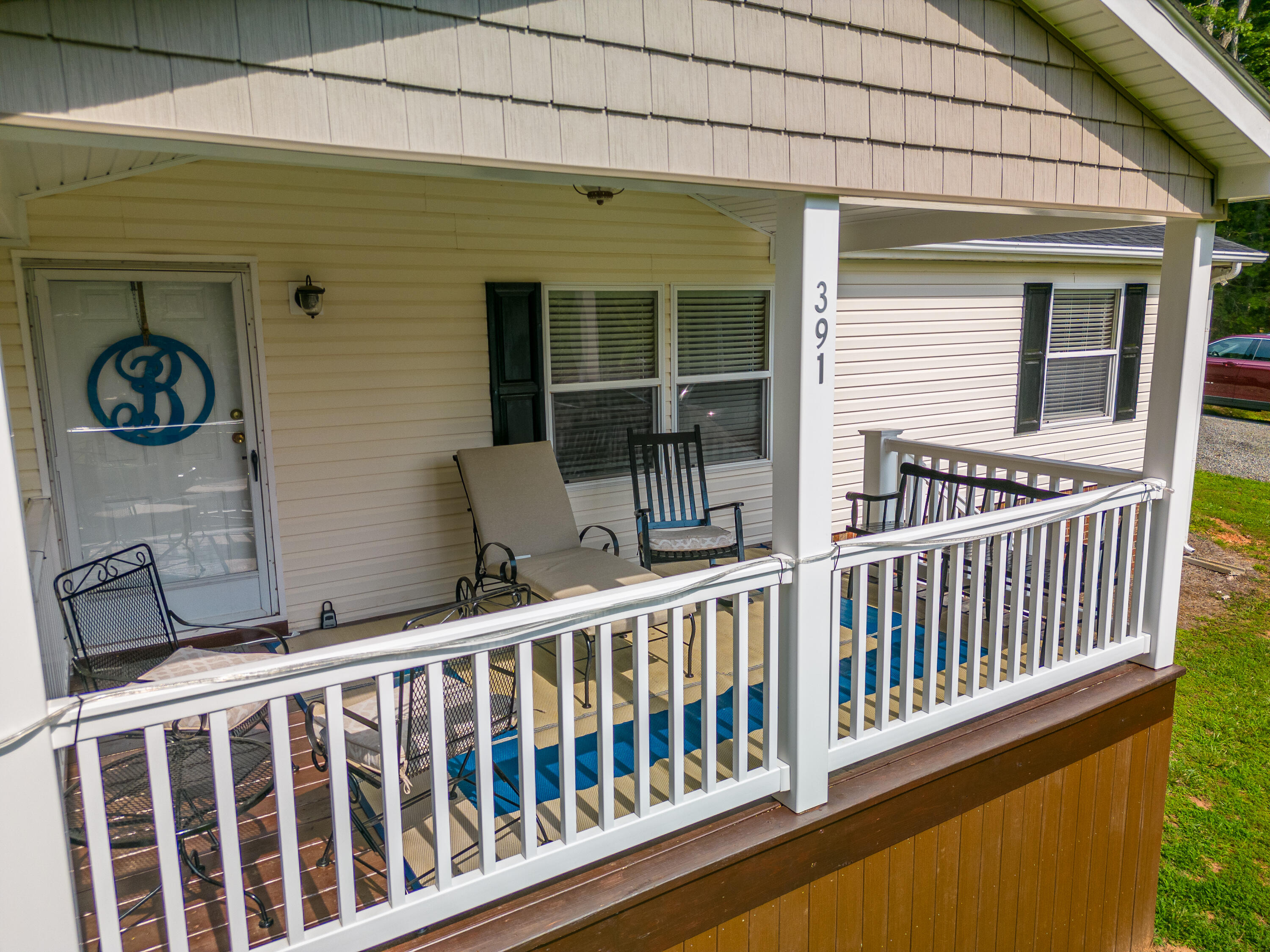 391 Cool Branch Road Penhook, VA 24137 - Photo 3 of 54 a view of a two chairs and table in a balcony