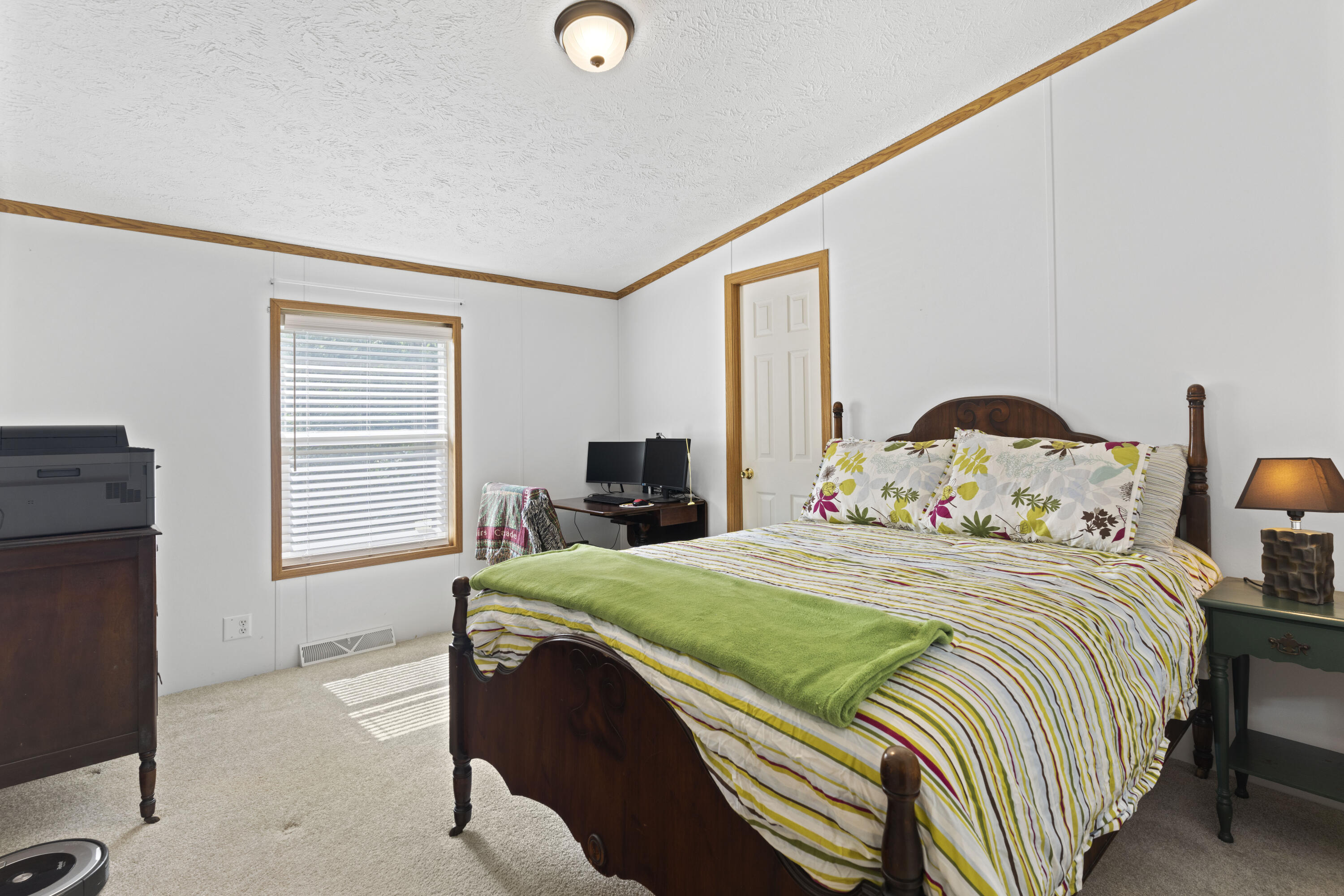 391 Cool Branch Road Penhook, VA 24137 - Photo 34 of 54 a bedroom with a bed and a window
