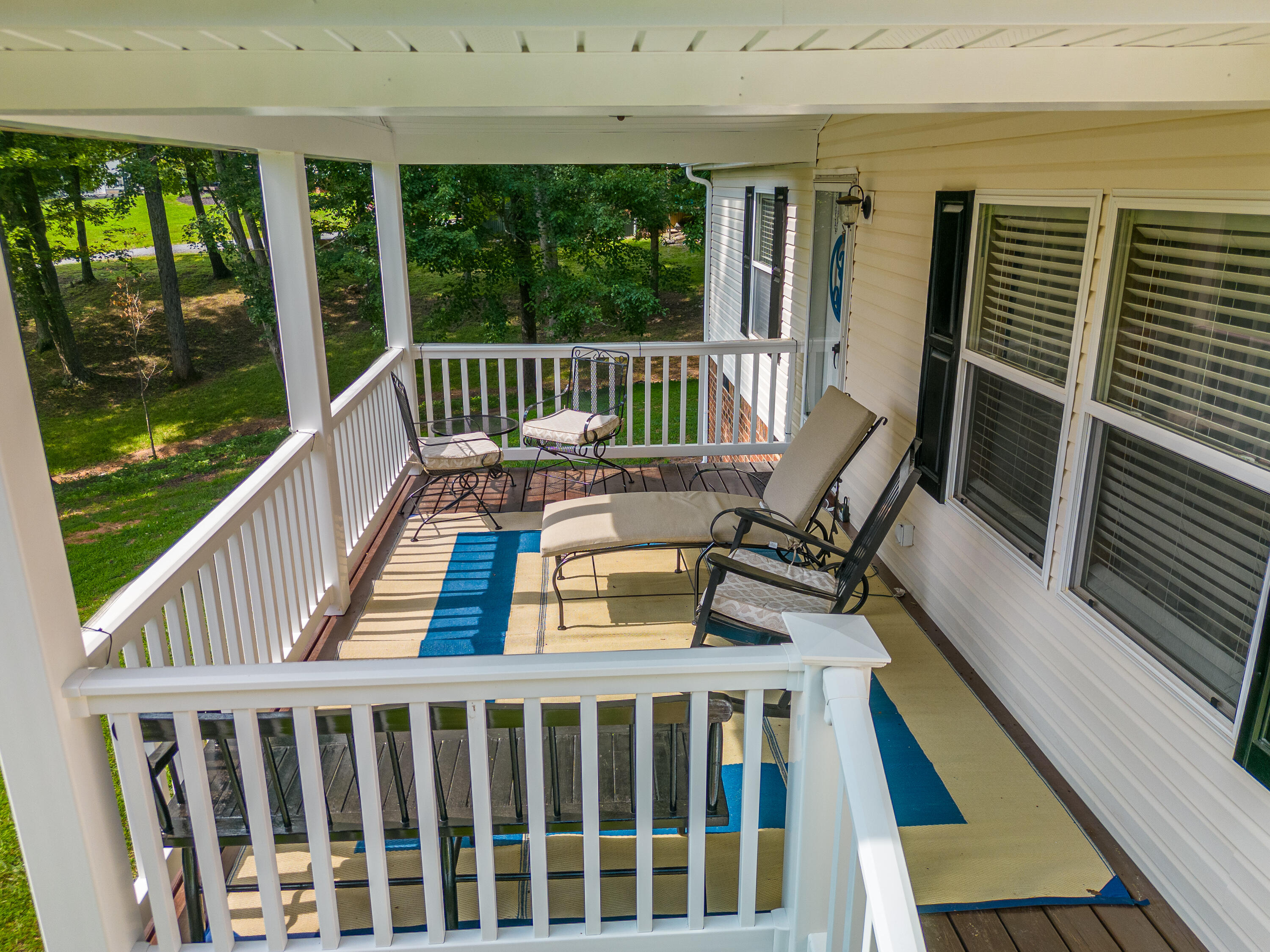 391 Cool Branch Road Penhook, VA 24137 - Photo 4 of 54 a view of a two chairs and table in the balcony