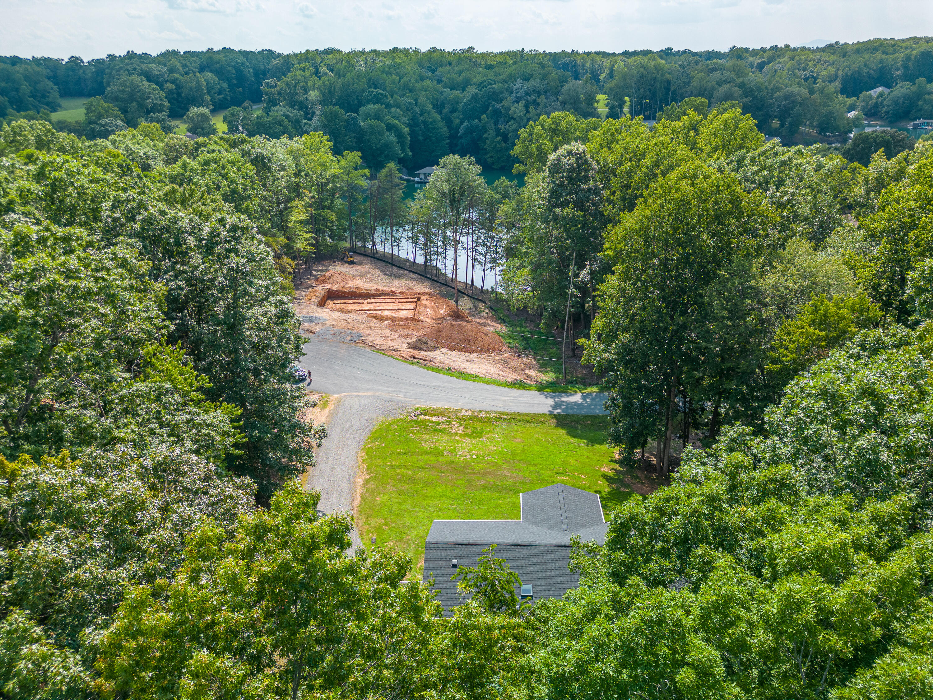 391 Cool Branch Road Penhook, VA 24137 - Photo 41 of 54 a view of a lake with a yard