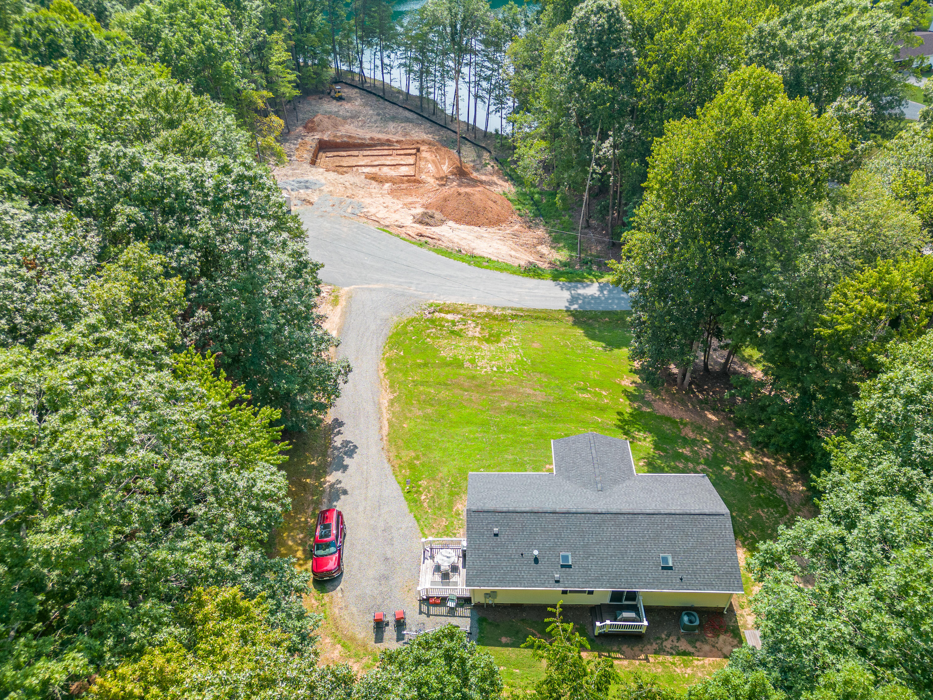 391 Cool Branch Road Penhook, VA 24137 - Photo 44 of 54 an aerial view of a house with a yard and a large tree