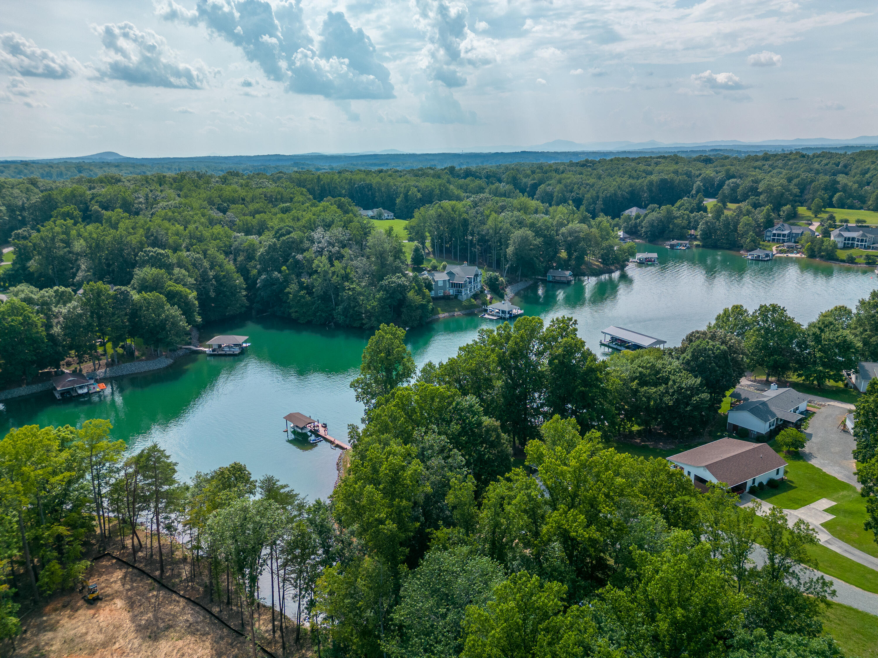 391 Cool Branch Road Penhook, VA 24137 - Photo 45 of 54 an aerial view of a houses with outdoor space and lake view