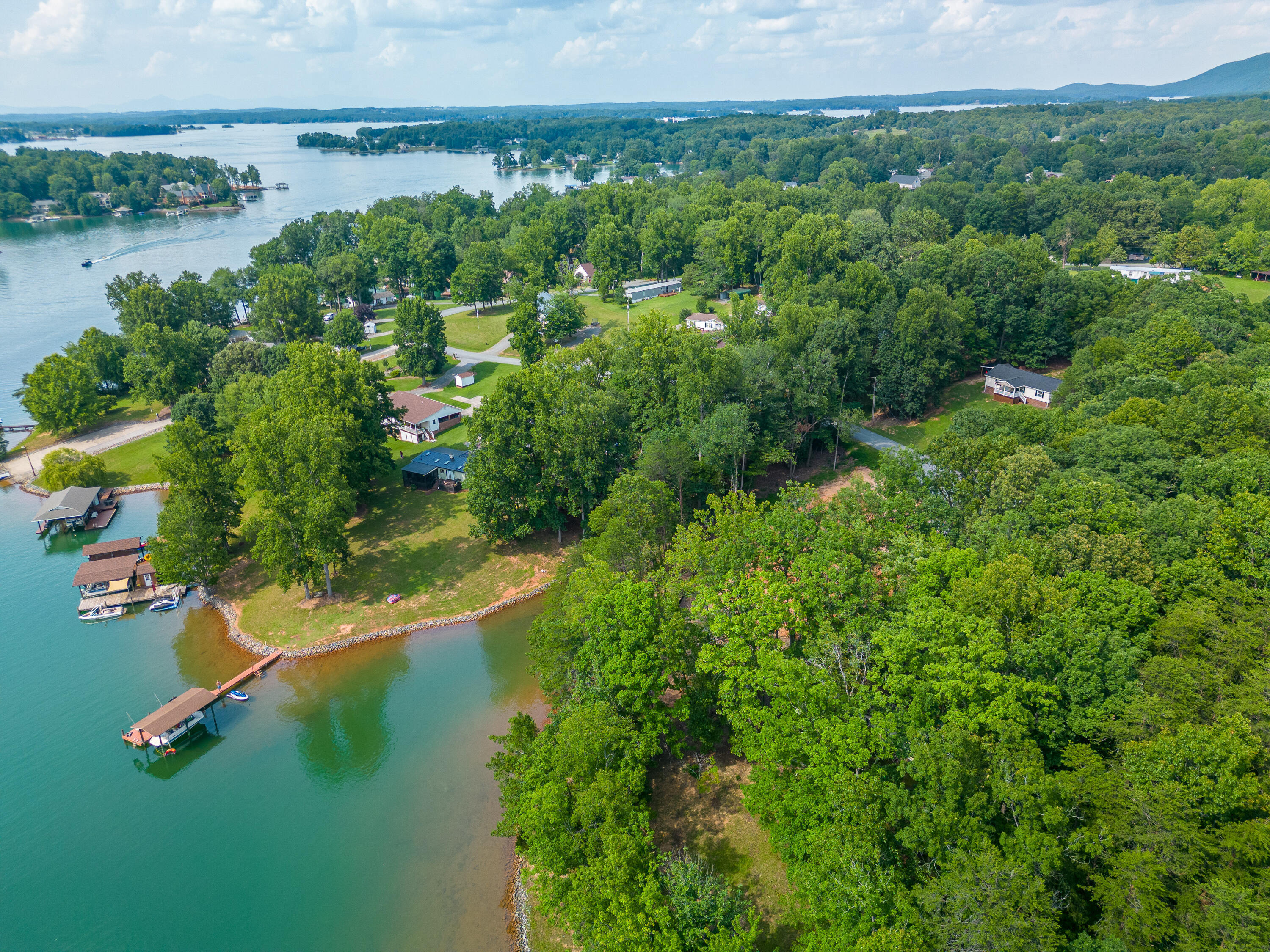391 Cool Branch Road Penhook, VA 24137 - Photo 49 of 54 an aerial view of residential houses with outdoor space and swimming pool