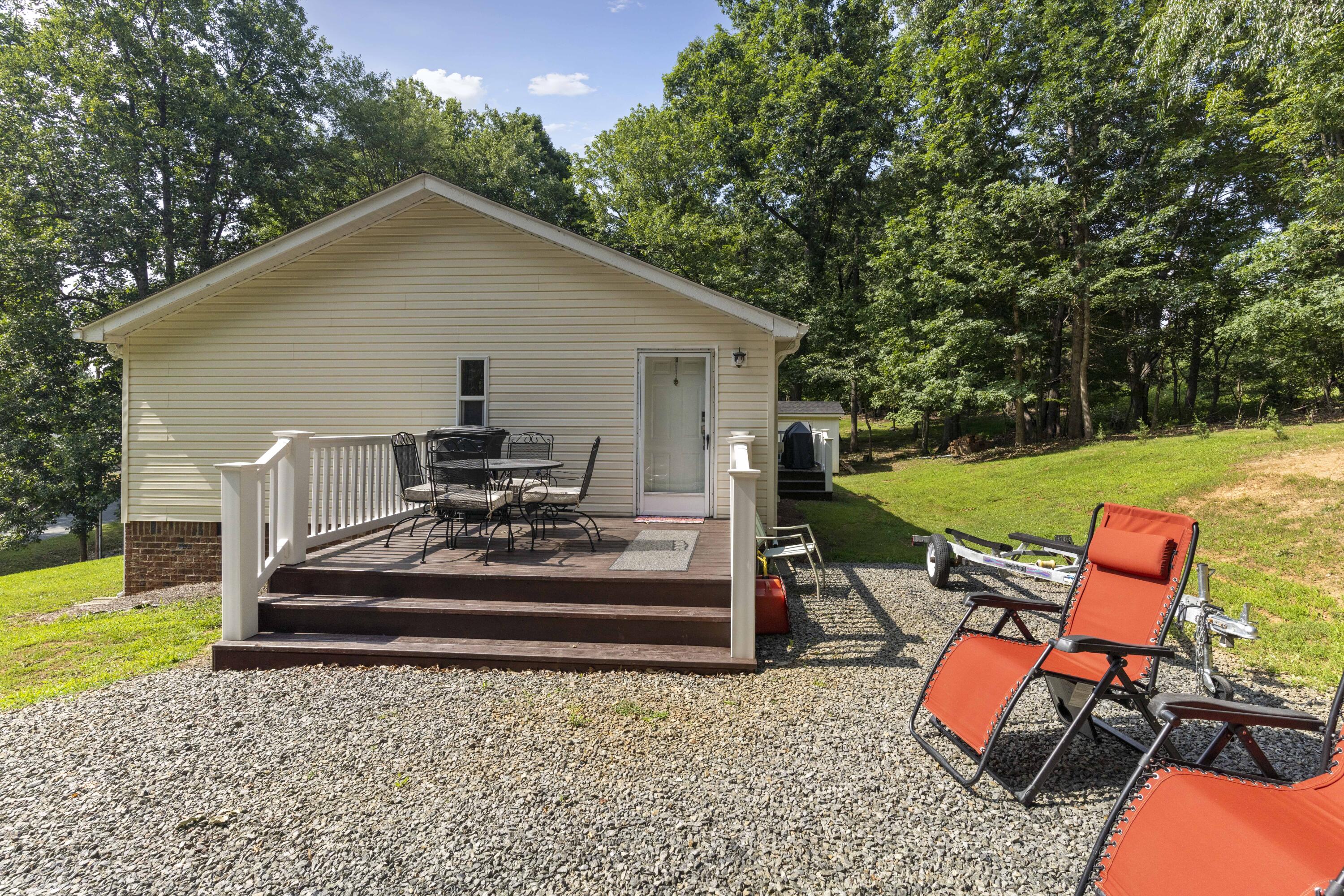 391 Cool Branch Road Penhook, VA 24137 - Photo 5 of 54 a view of a house with backyard and sitting area