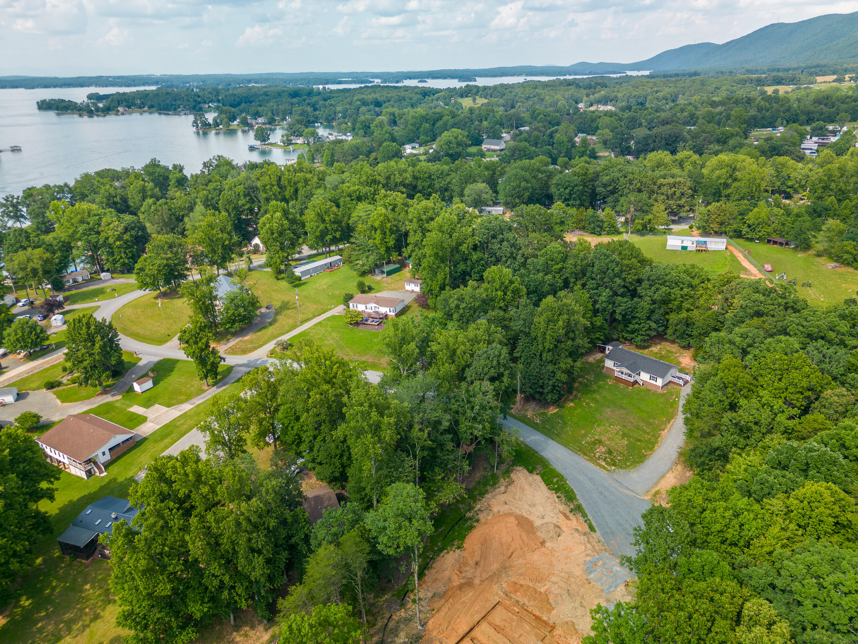 391 Cool Branch Road Penhook, VA 24137 - Photo 51 of 54 a view of a lake with a city view